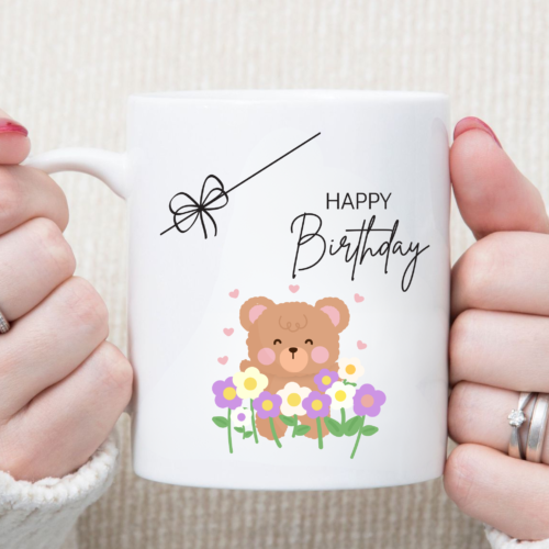 Adorable teddy and blooming flower artwork printed on a ceramic birthday mug