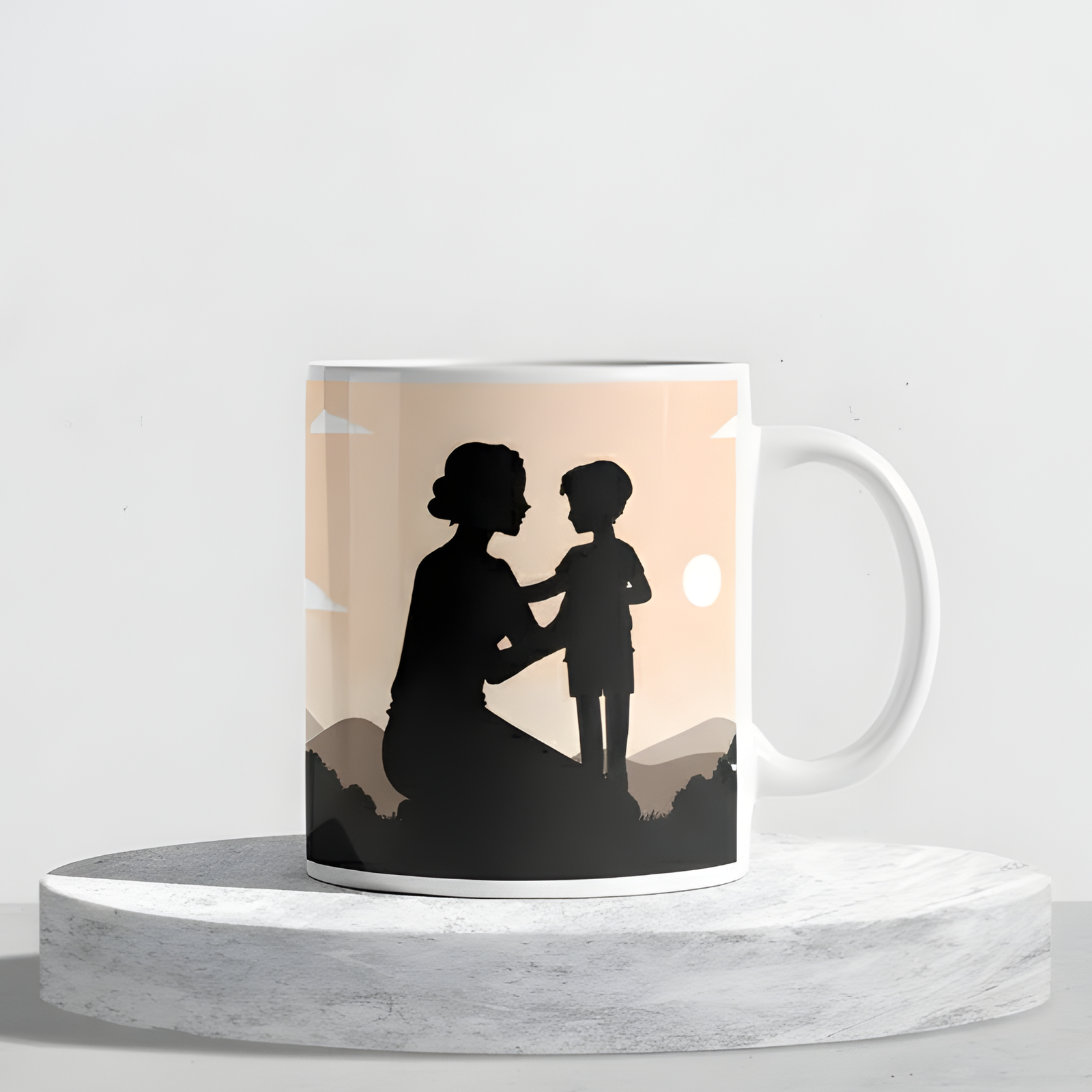 Silhouette of a mother and child at sunset printed on a ceramic mug displayed on a round marble stand.