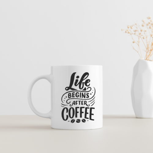 Life Begins After Coffee mug with bold black quote design, white ceramic coffee cup for caffeine lovers.